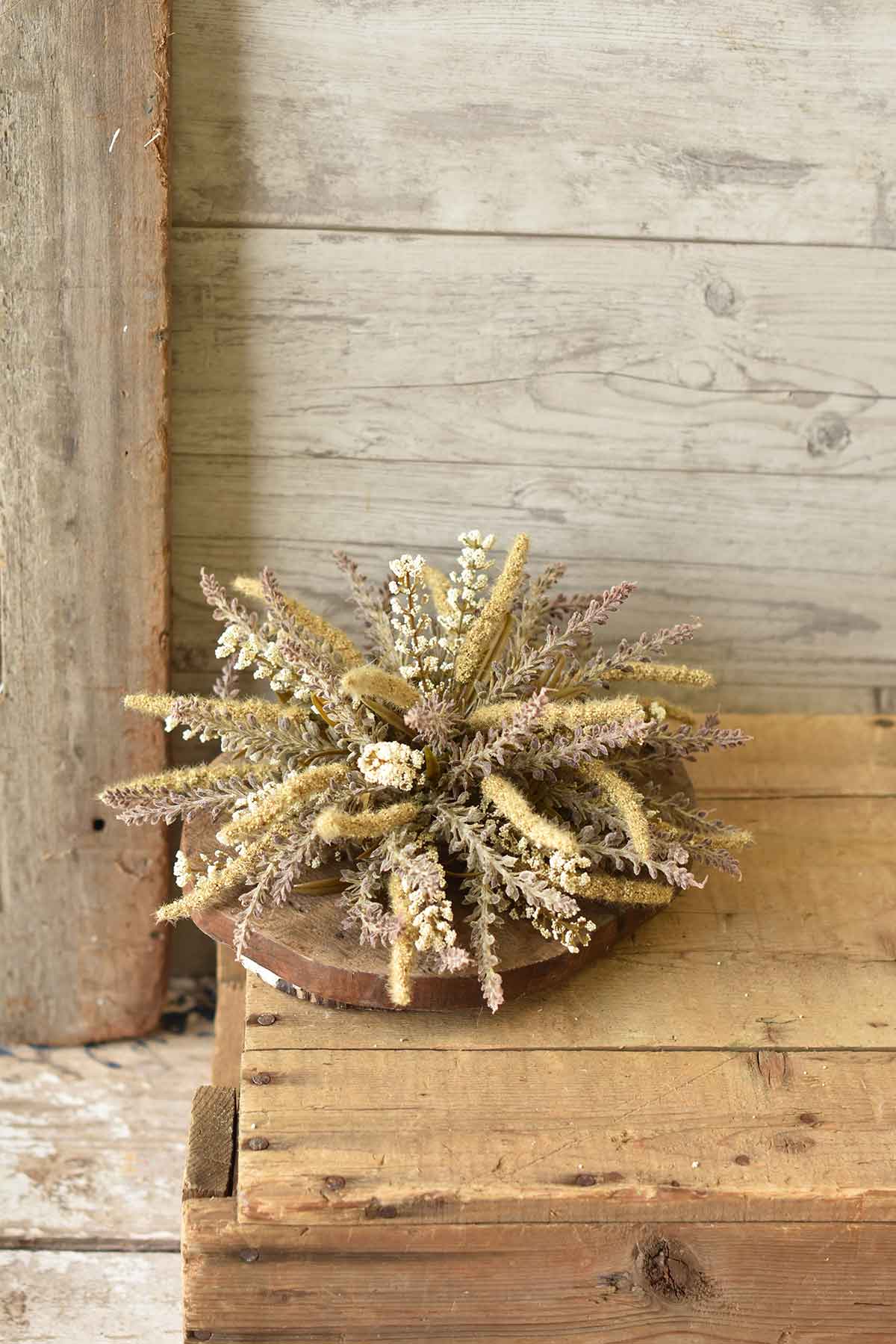 A neutral collection full of texture and charm. Sprays of tiny bubble berries mixed with lavender like spires.